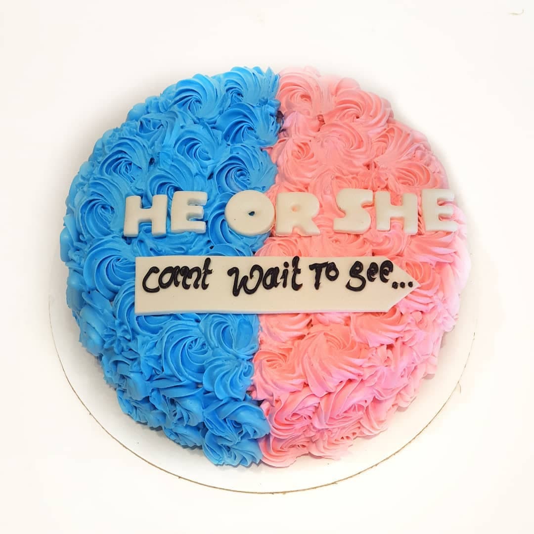Half blue and half pink celebration cake