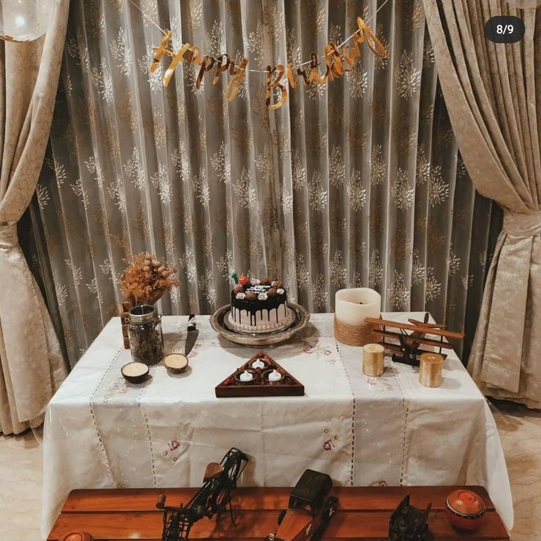 Elegant dessert table with cakes and flowers